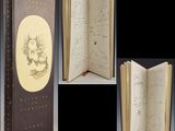 an open book with a drawing of a cat on it and a drawing of a cat on the cover