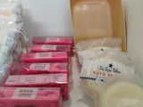 many bags of soaps and soap bars on the counter