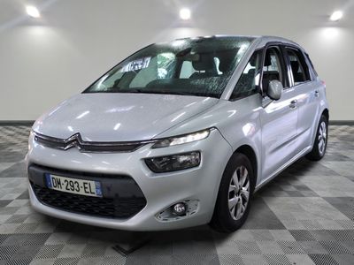 the silver citrole is parked on a checkered tile floor