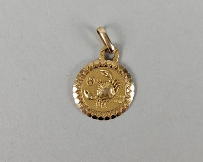 a close up of a gold coin on a white surface
