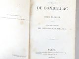 an old book opened to show the title of a novel