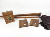 a wooden object that is sitting on a white surface