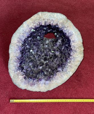 a picture of a piece of amethorate on a red surface