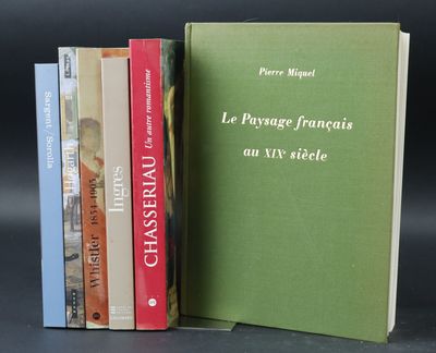 three books are stacked on top of each other on a table