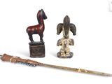 two figurines of horses and a horse on a table