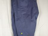 blue pants hanging on a hanger on a white sheet