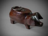 an image of a wooden pig with a ring on it ' s nose
