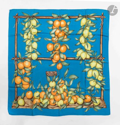 an image of a blue square scarf with oranges and lemons on it