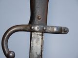 a close up of a knife with a metal handle