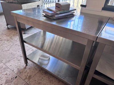 a stainless steel table with a book on top of it