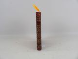 candles are lit on a white surface with a white background