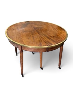 a round table with a wooden top on wheels