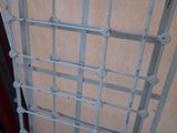 a metal gate that has a bunch of metal bars attached to it