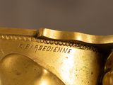 a close up of a gold statue of a person