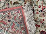 an image of a close up of a rug with a bird on it
