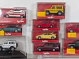 a lot of different models of cars in a display case