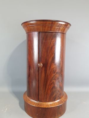 a small wooden cabinet with a door on it