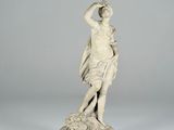 an image of a statue of a woman holding a flower