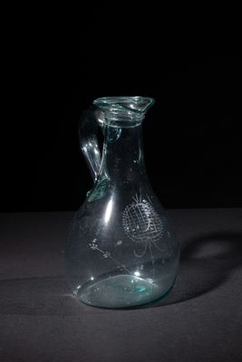 a glass vase that is sitting on a table