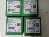 four green boxes with white labels on them sitting on top of a table