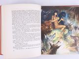 an open book with a picture of a woman surrounded by animals