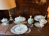 a table with a bunch of plates and bowls on it