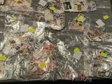 a lot of stamps and post it notes on the table