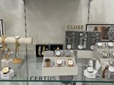 many watches on display in a glass case