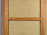 an old picture of a wooden frame with a picture in it