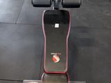a machine that is sitting on the floor in the gym