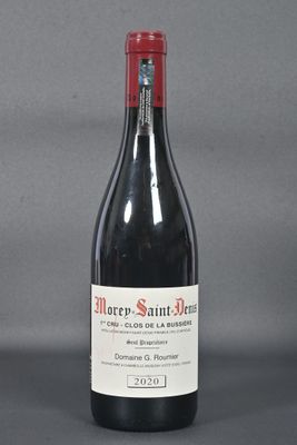 a bottle of wine that is sitting on a table