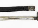 pair of old knives on a white surface with a white background