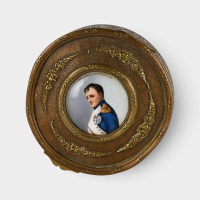a miniature picture of a woman in a blue dress