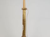 an image of a gold and black lamp on a white background