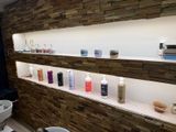 many different types of hair products displayed on the shelves