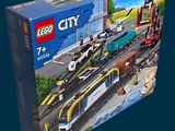 a box with a lego city train set in it