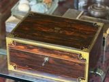 a small wooden box sitting on a glass table