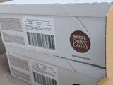boxes of donuts are stacked on top of each other on the floor