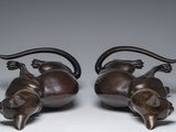 pair of bronze figurines of a bull and a cow