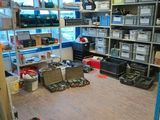 a room with a lot of boxes and tools on the floor