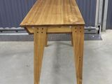 an image of a wooden table in a warehouse
