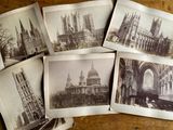 several old black and white photos of cathedrals and buildings on a table
