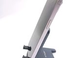 a cell phone that is sitting on top of a stand