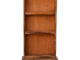 an image of a wooden bookcase with three shelves on one side and a shelf on the other
