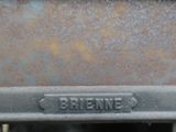 a close up of a metal object with the word brineme written on it