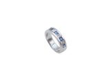 a close up of a ring with blue sapphires on a white background