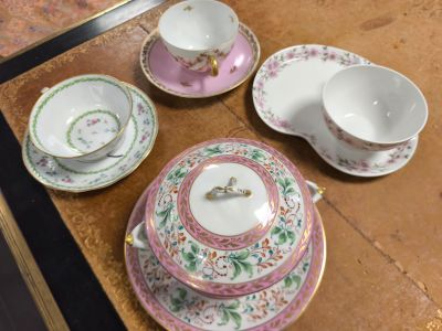 a table with a bunch of plates and bowls on it