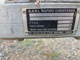 a sign on the back of a motorcycle that says sarl hapido caravans