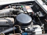 a close up of a car ' s engine with its hood open