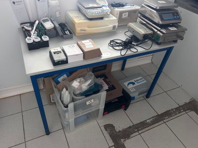 a table with a bunch of electronic equipment on it